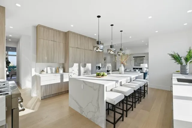 a large kitchen with a table and chairs