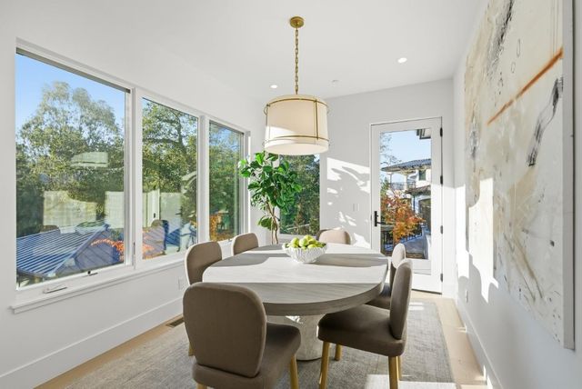 a dining room with furniture window wooden floor
