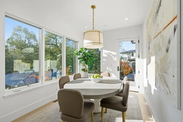 a dining room with furniture window wooden floor