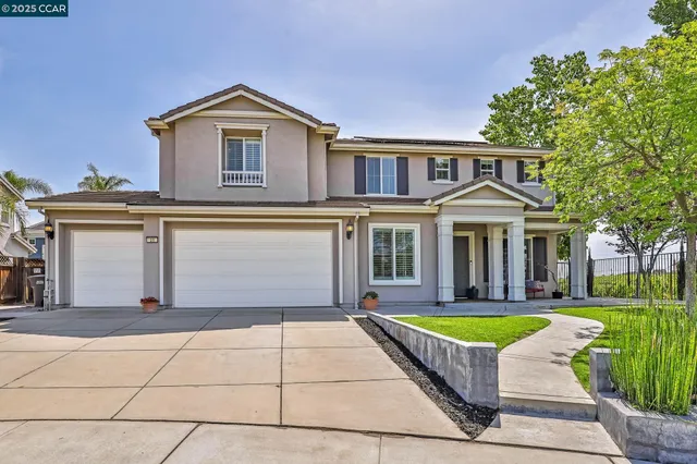 a front view of a house with swimming pool having outdoor seating
