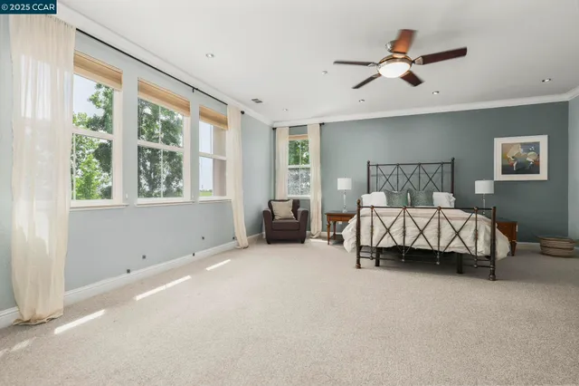 a spacious bedroom with a bed and window