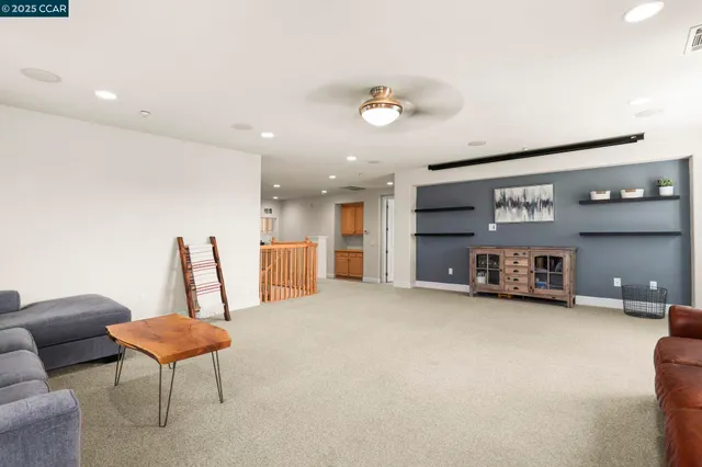 a view of a room with furniture and a chandelier