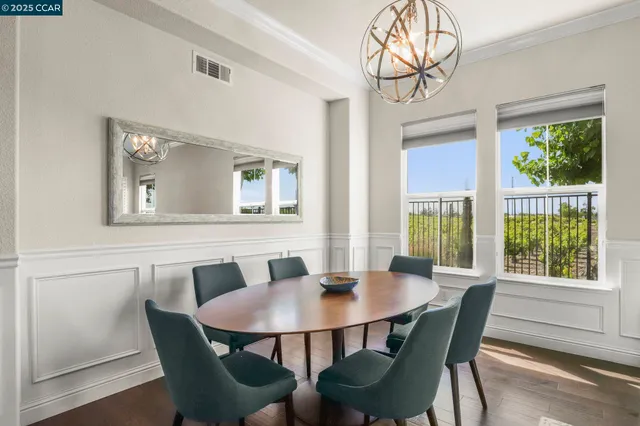 a view of a dining room with furniture window and outside view