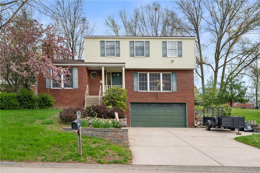 201 Cameron Drive Irwin, PA 15642 - Photo 1 of 30 a front view of a house with garden