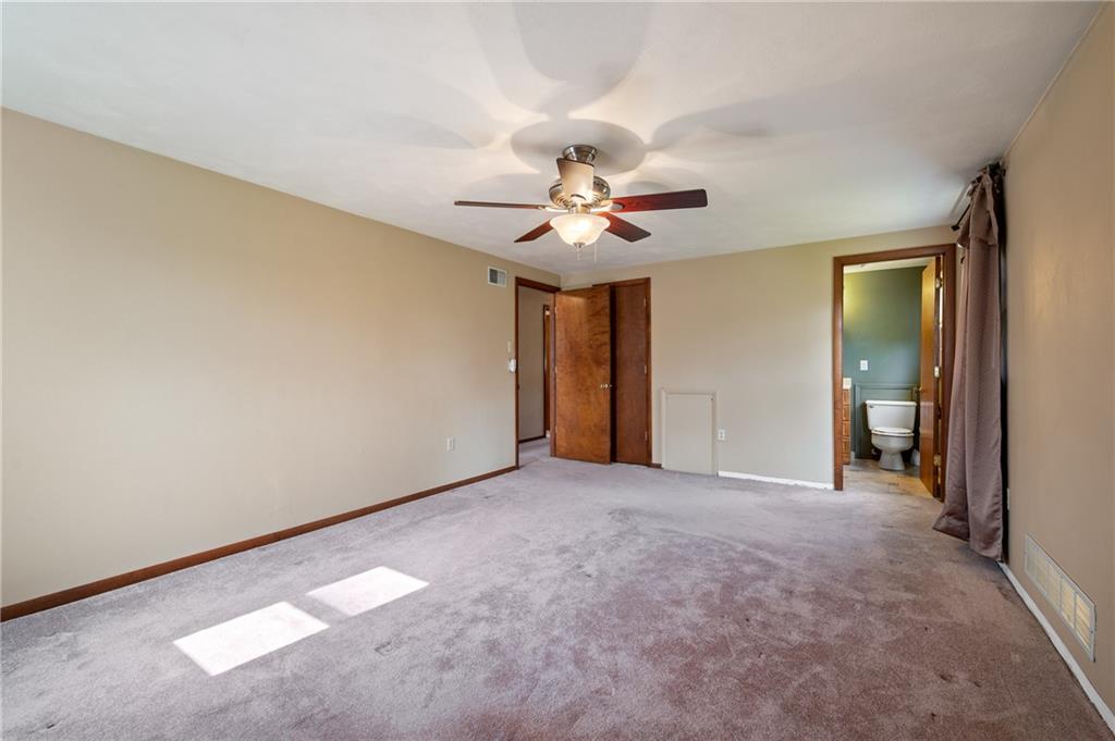 201 Cameron Drive Irwin, PA 15642 - Photo 17 of 30 a view of a room with a ceiling fan and a window