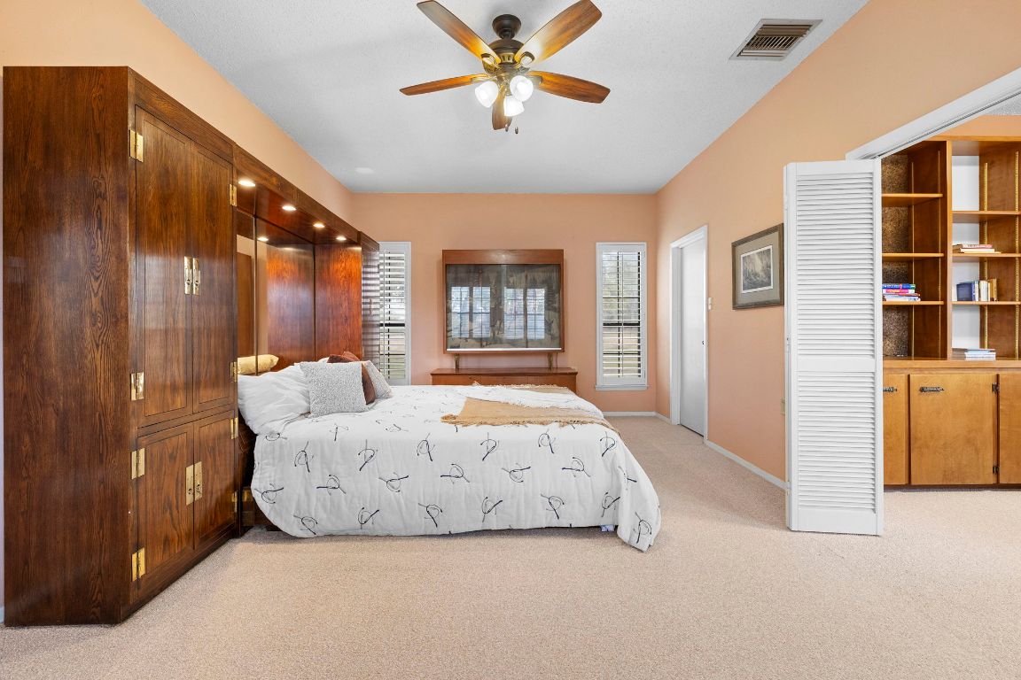 315 Flying R Ranch Road Spring Branch, TX 78070 - Photo 12 of 39 Bedroom with light colored carpet and a ceiling fan