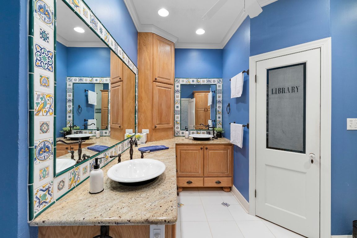315 Flying R Ranch Road Spring Branch, TX 78070 - Photo 14 of 39 Full bath featuring crown molding, light tile patterned floors, double vanity, and recessed lighting