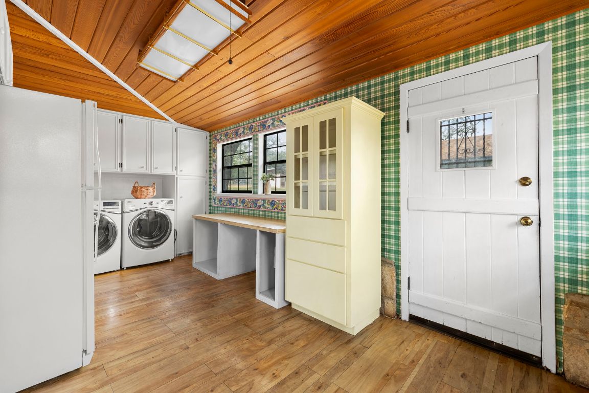 315 Flying R Ranch Road Spring Branch, TX 78070 - Photo 20 of 39 Laundry room featuring wooden ceiling, cabinet space, washer and dryer, light wood-style flooring, and vaulted ceiling