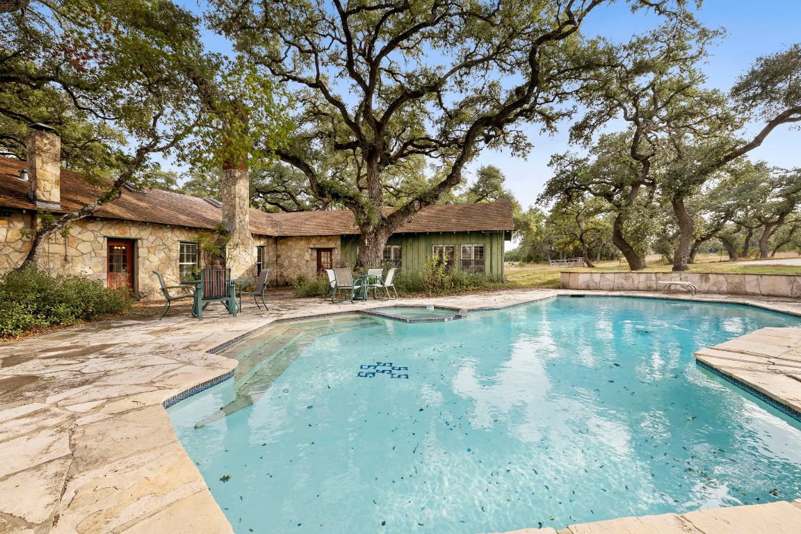315 Flying R Ranch Road Spring Branch, TX 78070 - Photo 22 of 39 View of pool featuring a patio and a pool with connected hot tub