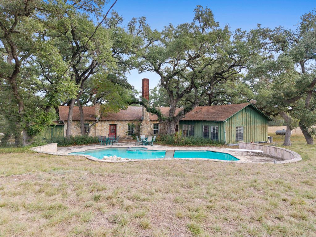 315 Flying R Ranch Road Spring Branch, TX 78070 - Photo 24 of 39 View of swimming pool with a patio, a yard, and a pool with connected hot tub