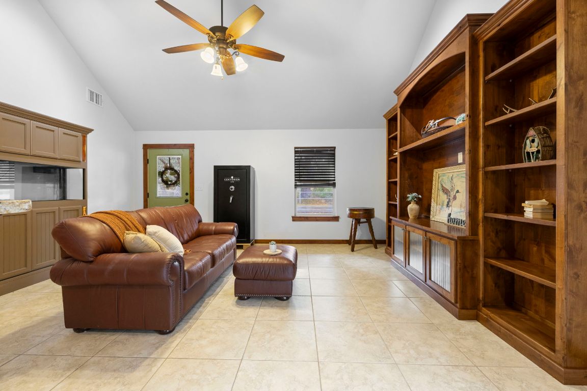 315 Flying R Ranch Road Spring Branch, TX 78070 - Photo 26 of 39 Living area with high vaulted ceiling, a ceiling fan, and light tile patterned floors