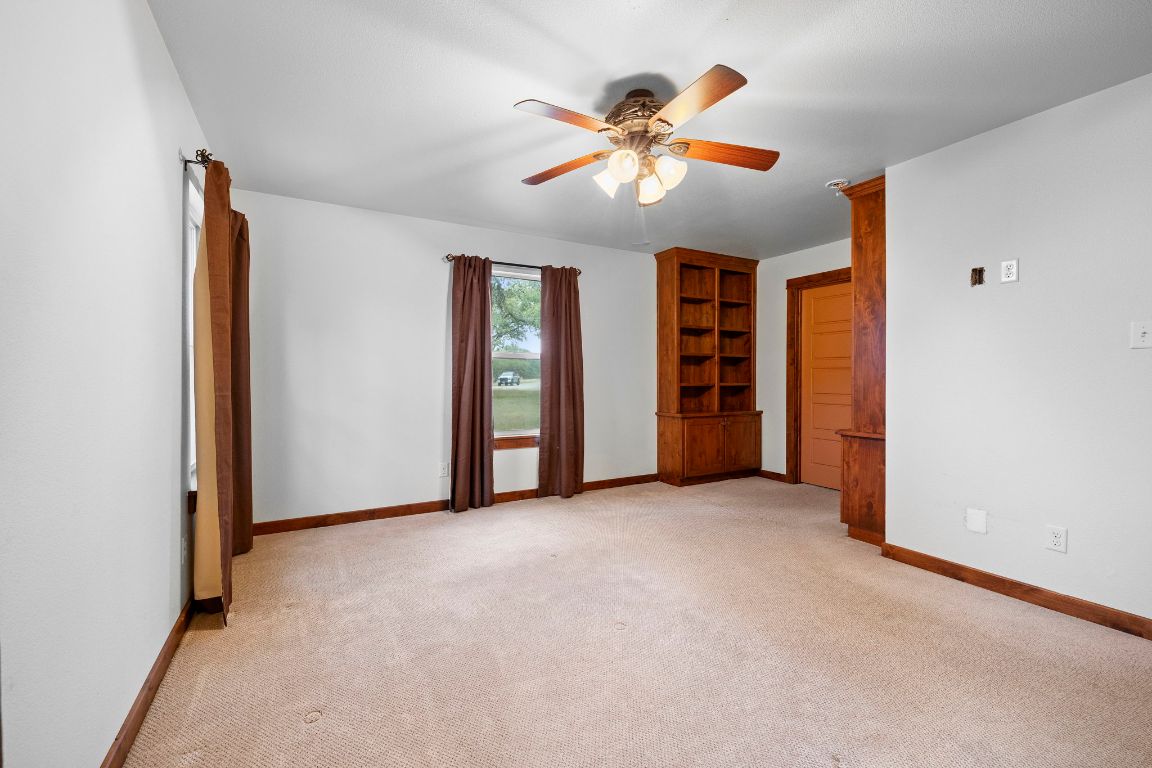 315 Flying R Ranch Road Spring Branch, TX 78070 - Photo 31 of 39 Spare room featuring light colored carpet and ceiling fan