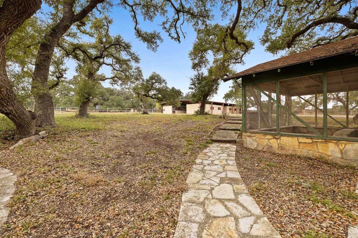 315 Flying R Ranch Road Spring Branch, TX 78070 - Photo 35 of 39 View of yard featuring a sunroom