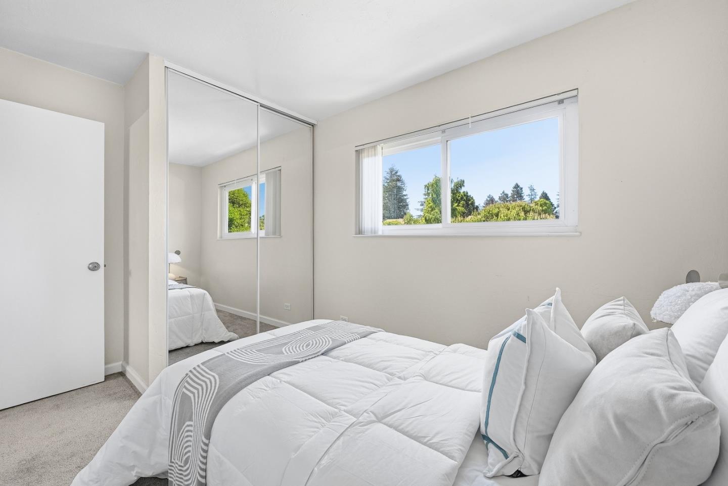 701 North Rengstorff Avenue, Unit 7 Mountain View, CA 94043 - Photo 21 of 32 a bedroom with a bed and a painting on the wall