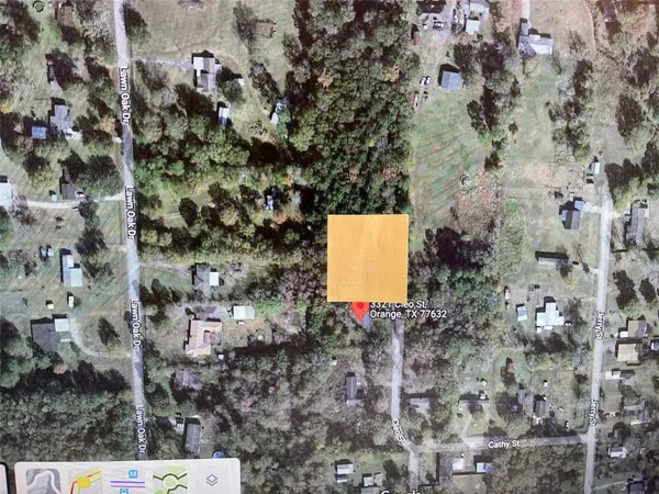 a aerial view of a house with a yard