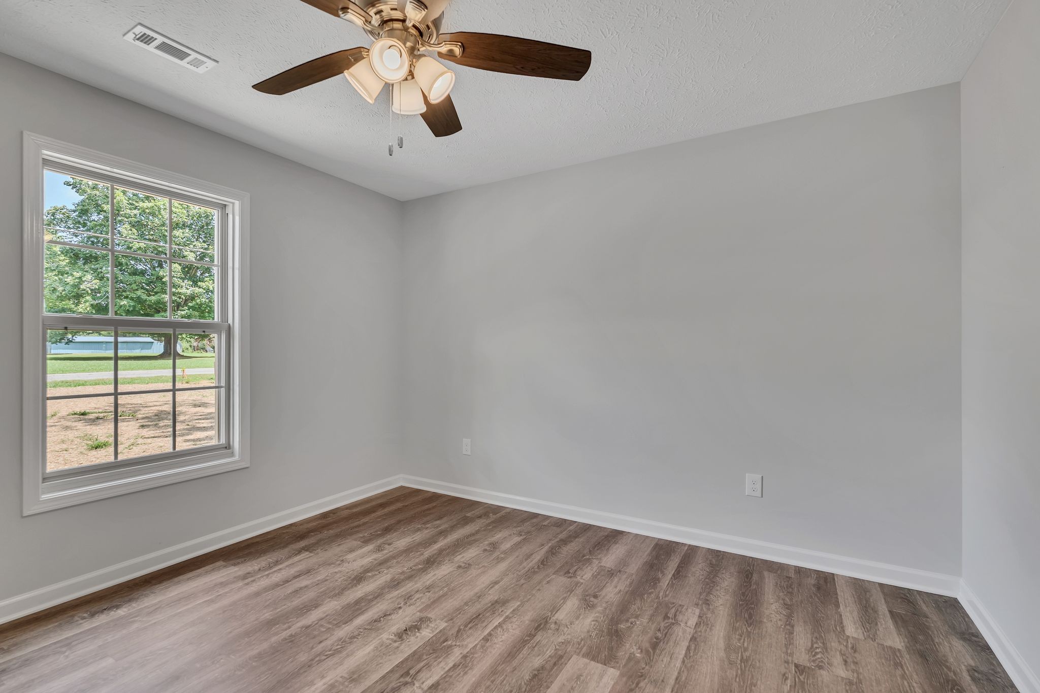 517 Paynes Church Road Winchester, TN 37398 - Photo 24 of 36 an empty room with a window and a ceiling fan