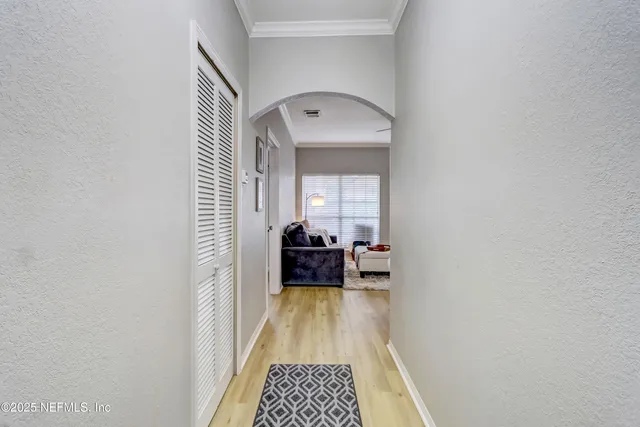 a view of bedroom with wooden floor