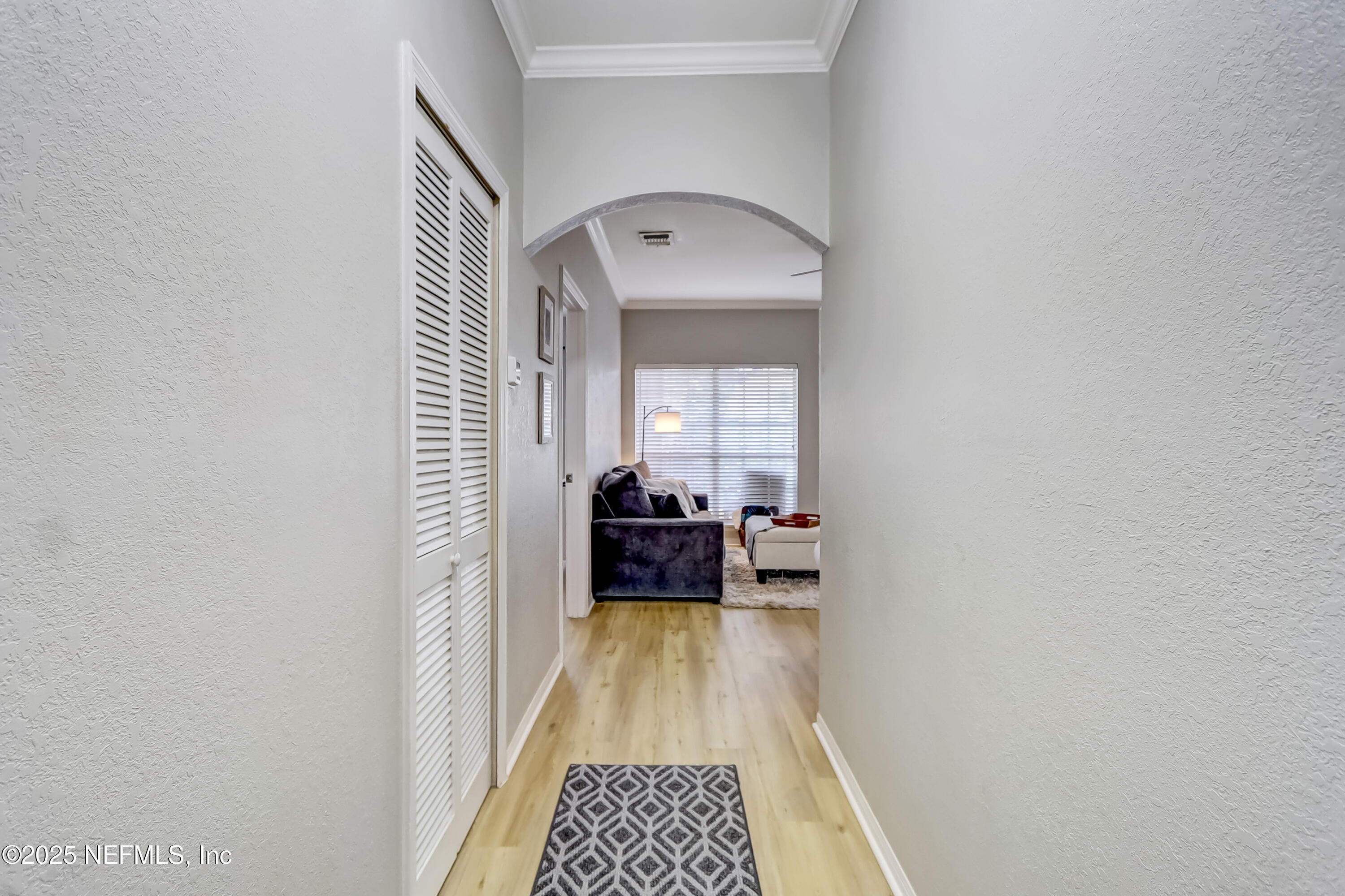 a view of bedroom with wooden floor