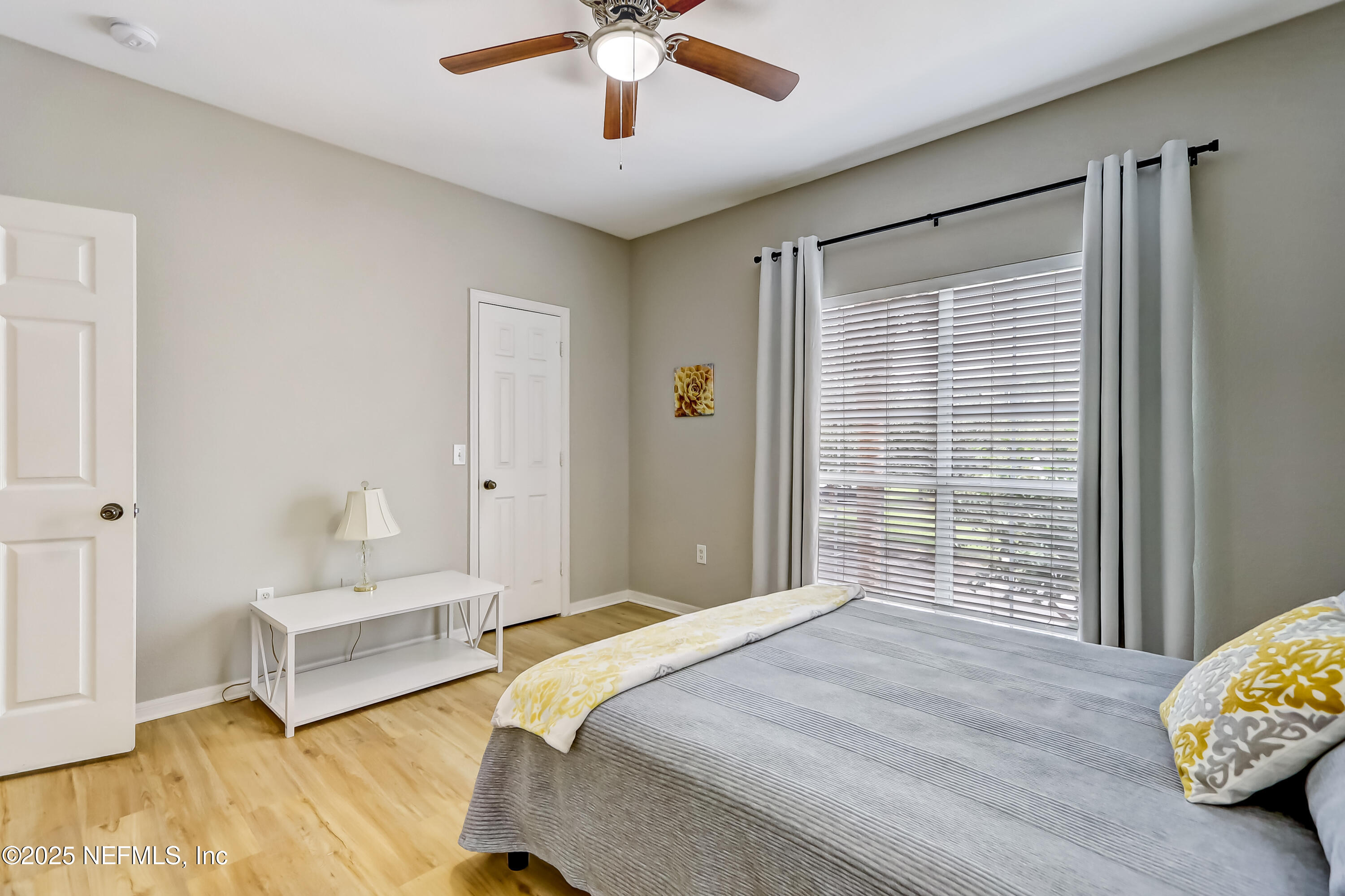 10961 Burnt Mill Road, Unit 328 Jacksonville, FL 32256 - Photo 19 of 33 a bedroom with a bed and a window