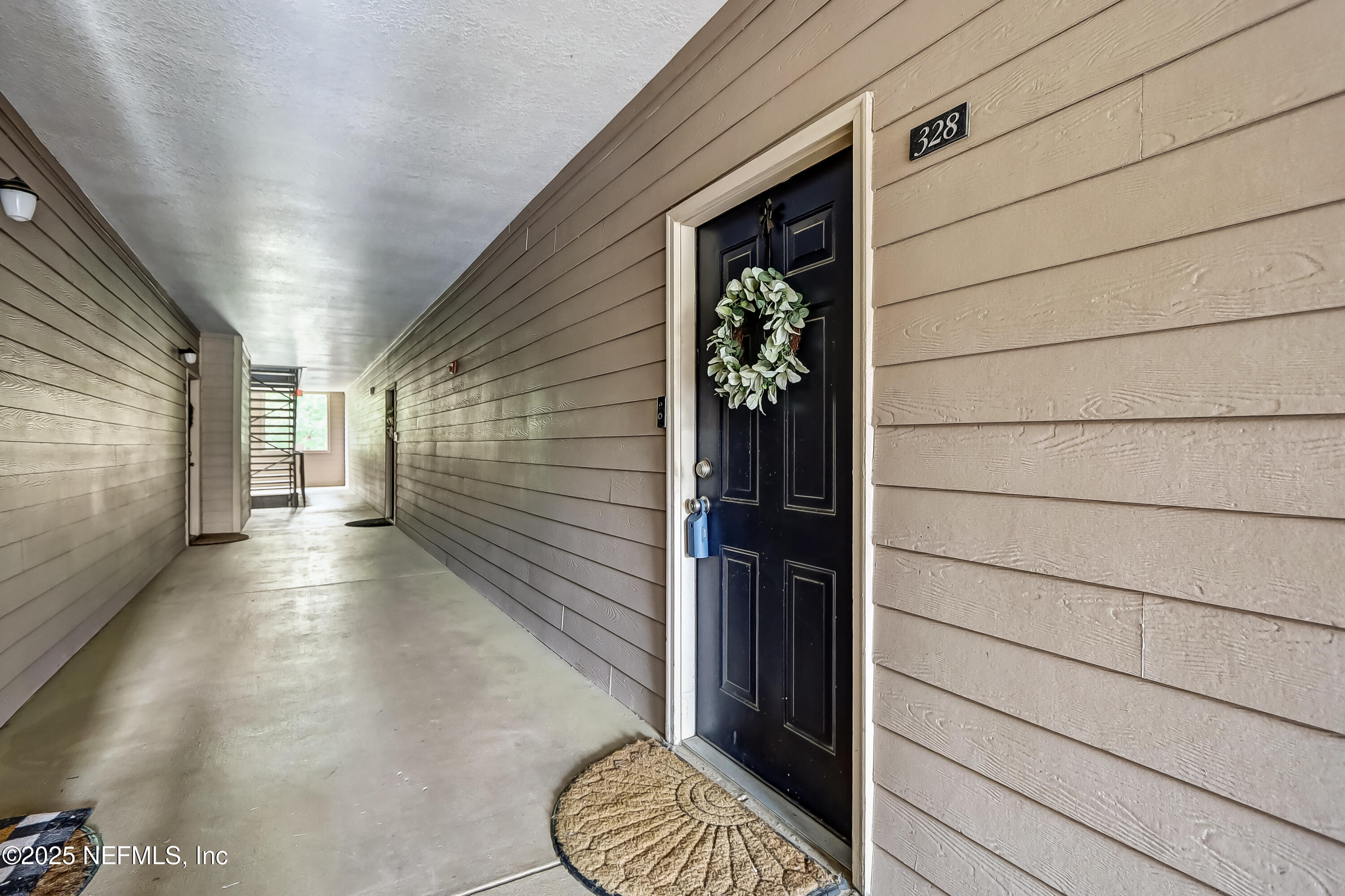 10961 Burnt Mill Road, Unit 328 Jacksonville, FL 32256 - Photo 24 of 33 a view of wooden door