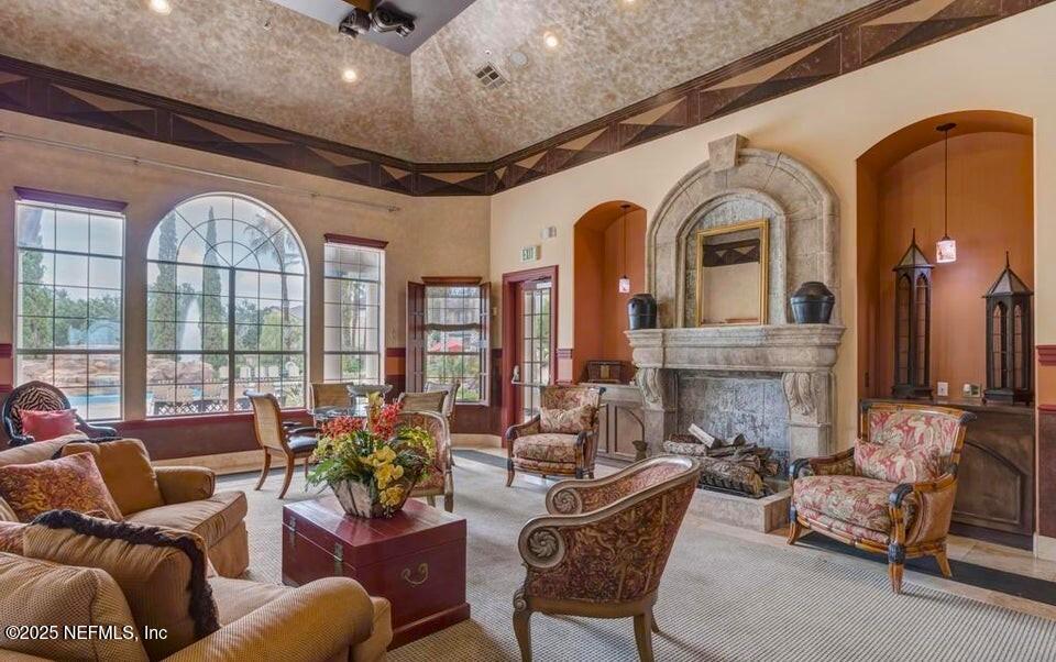 10961 Burnt Mill Road, Unit 328 Jacksonville, FL 32256 - Photo 29 of 33 a living room with furniture fireplace and a large window