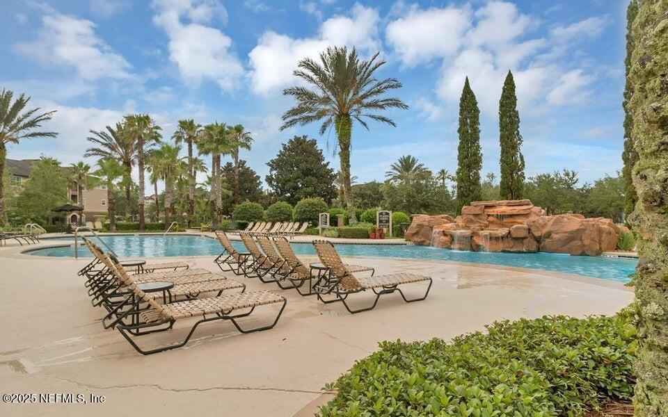 10961 Burnt Mill Road, Unit 328 Jacksonville, FL 32256 - Photo 30 of 33 a view of swimming pool with outdoor seating and plants