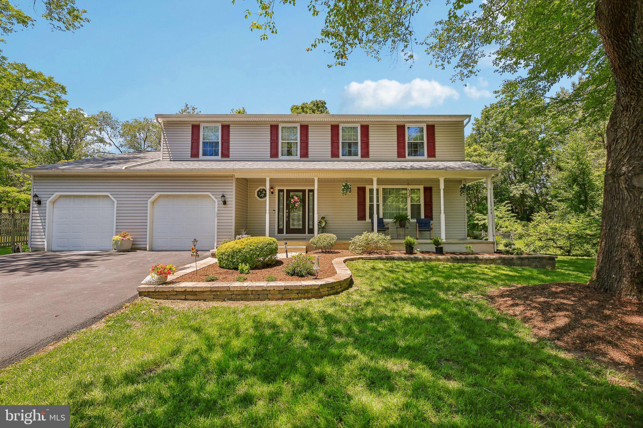 9202 Stone Spring Lane Pasadena, MD 21122 - Photo 1 of 43 a house view with a garden space