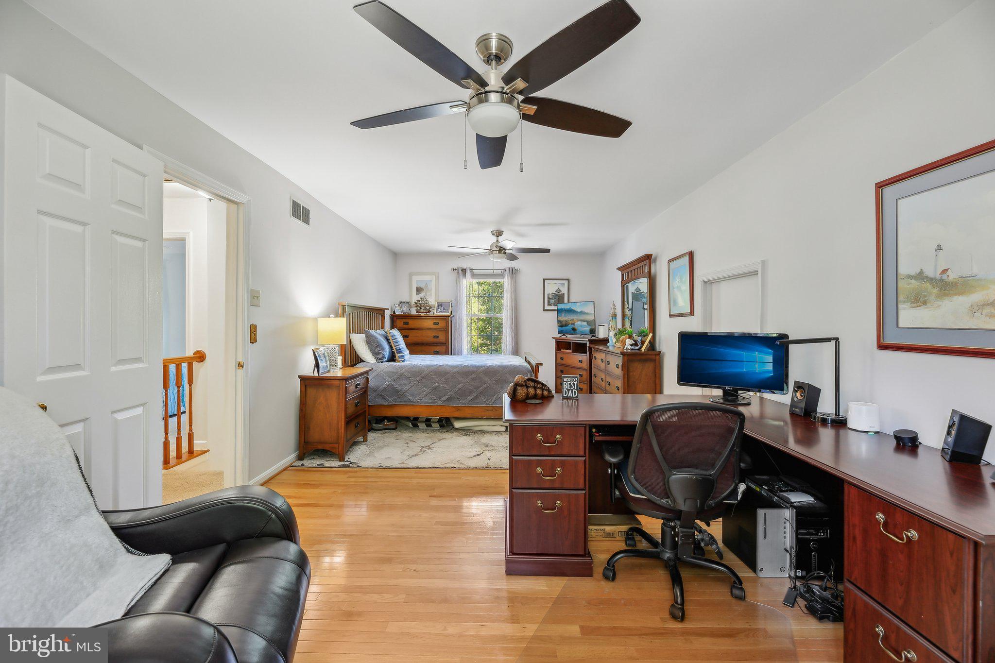 9202 Stone Spring Lane Pasadena, MD 21122 - Photo 17 of 43 a bed room with furniture and a window