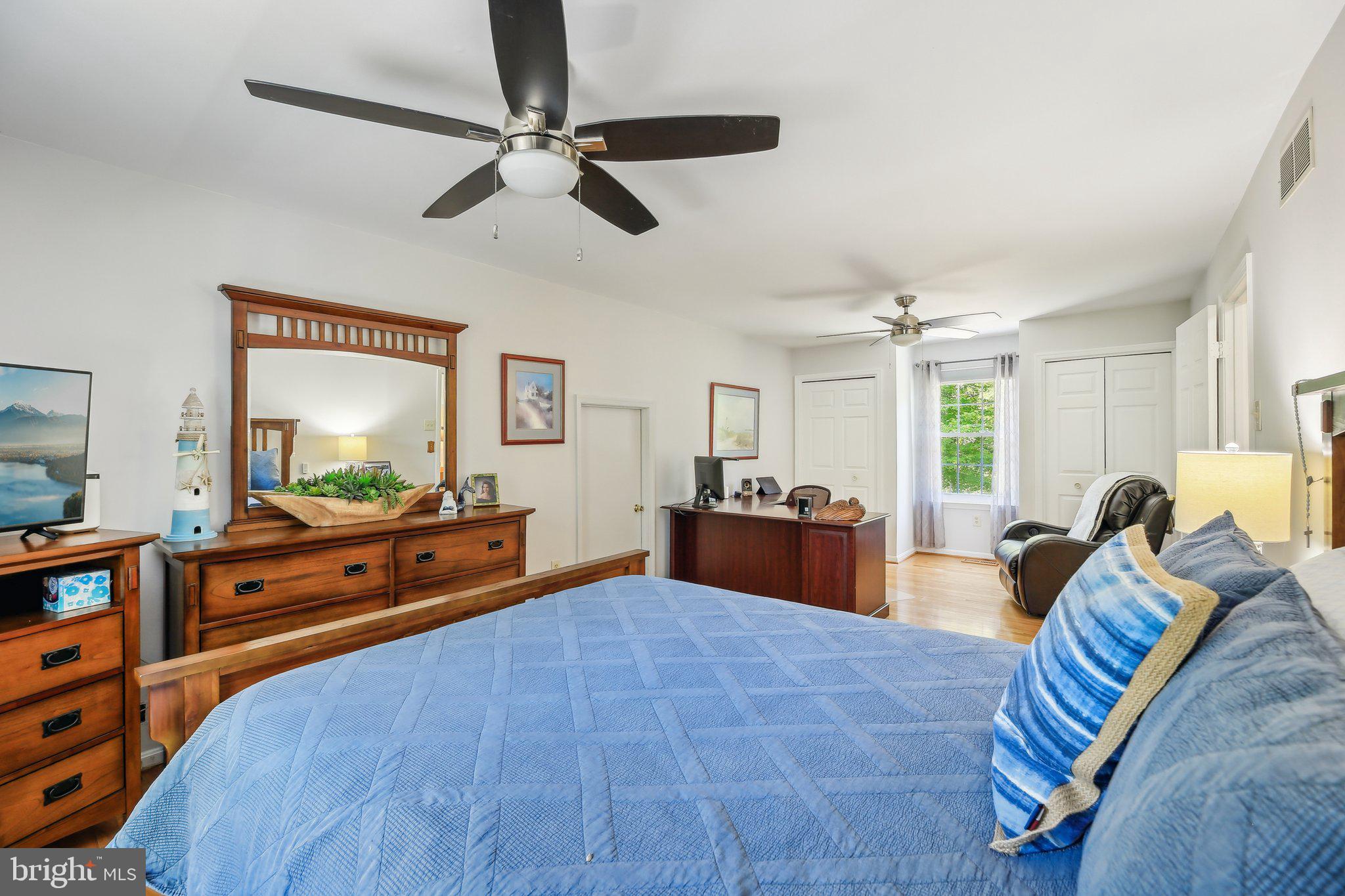 9202 Stone Spring Lane Pasadena, MD 21122 - Photo 19 of 43 a bed room with a bed window and dresser