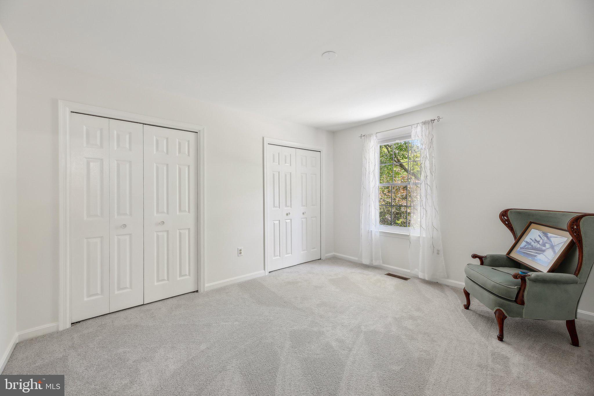 9202 Stone Spring Lane Pasadena, MD 21122 - Photo 27 of 43 a living room with furniture and a window