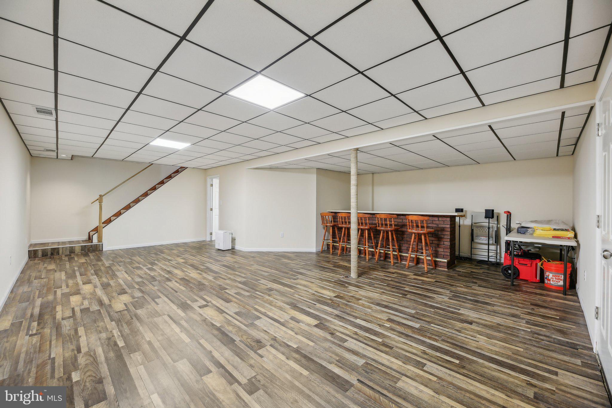 9202 Stone Spring Lane Pasadena, MD 21122 - Photo 30 of 43 a living room with a large window