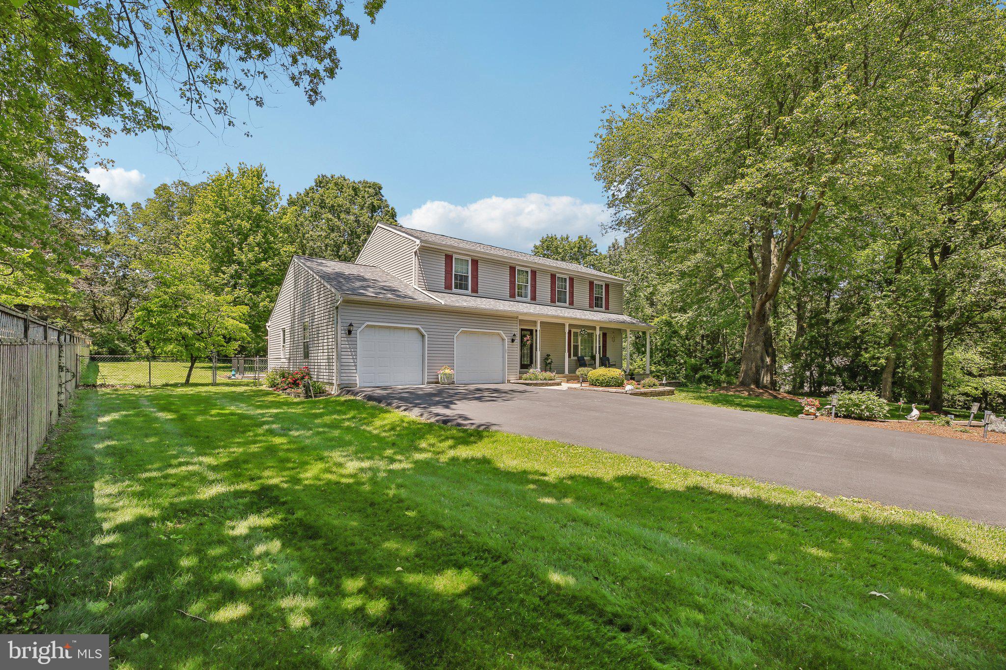 9202 Stone Spring Lane Pasadena, MD 21122 - Photo 3 of 43 a view of a house with a yard and sitting area
