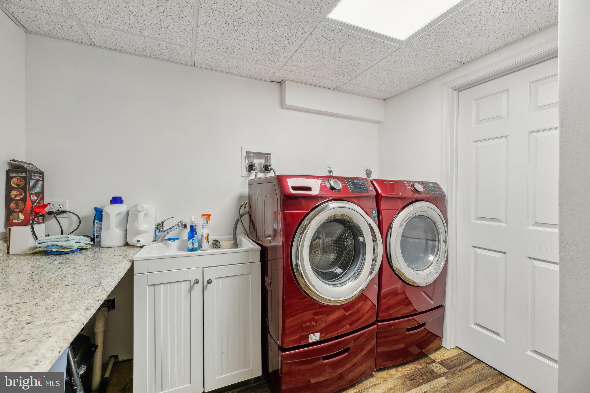 9202 Stone Spring Lane Pasadena, MD 21122 - Photo 31 of 43 a utility room with sink dryer and washer