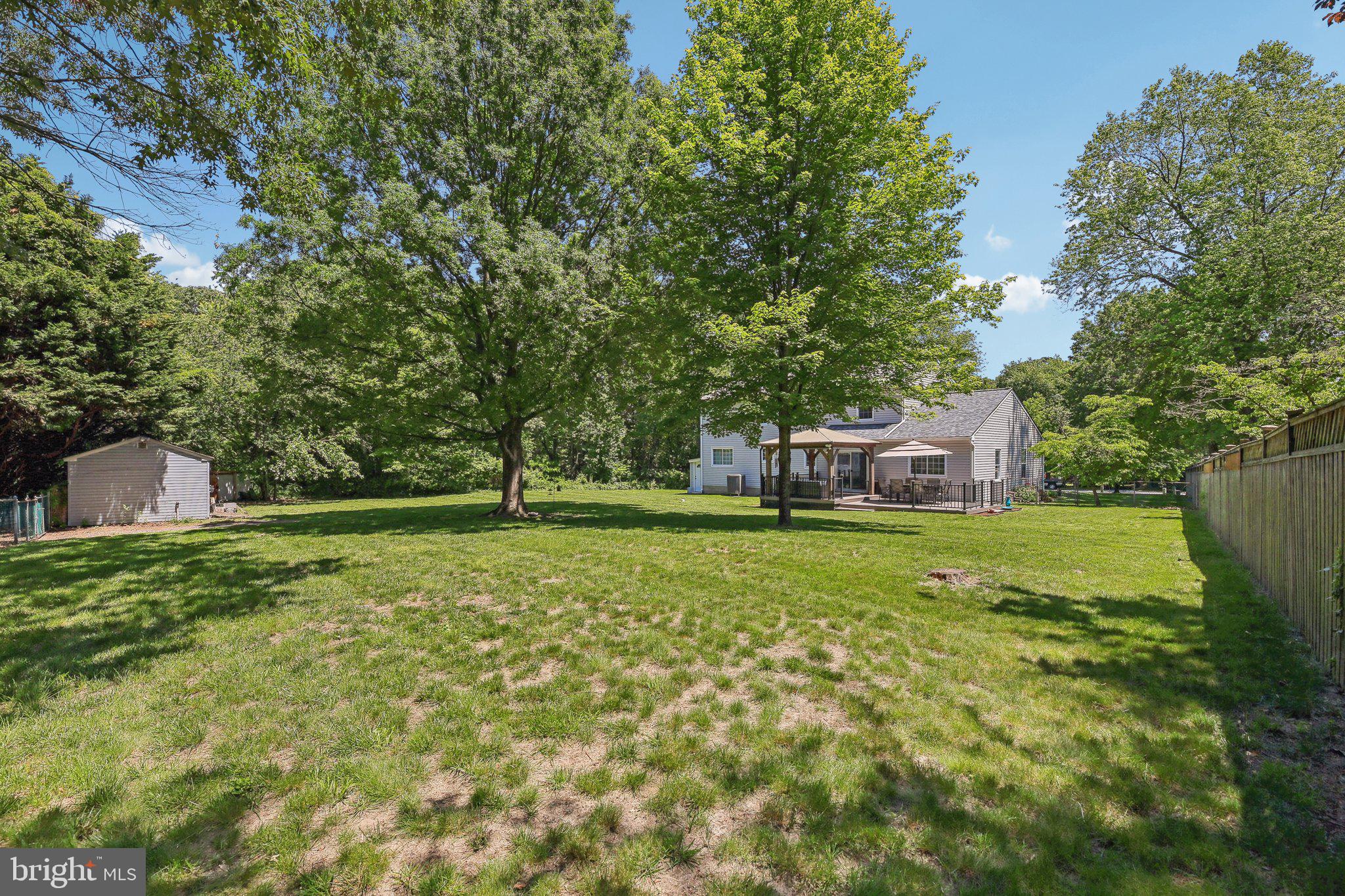 9202 Stone Spring Lane Pasadena, MD 21122 - Photo 36 of 43 a front view of a house with a yard