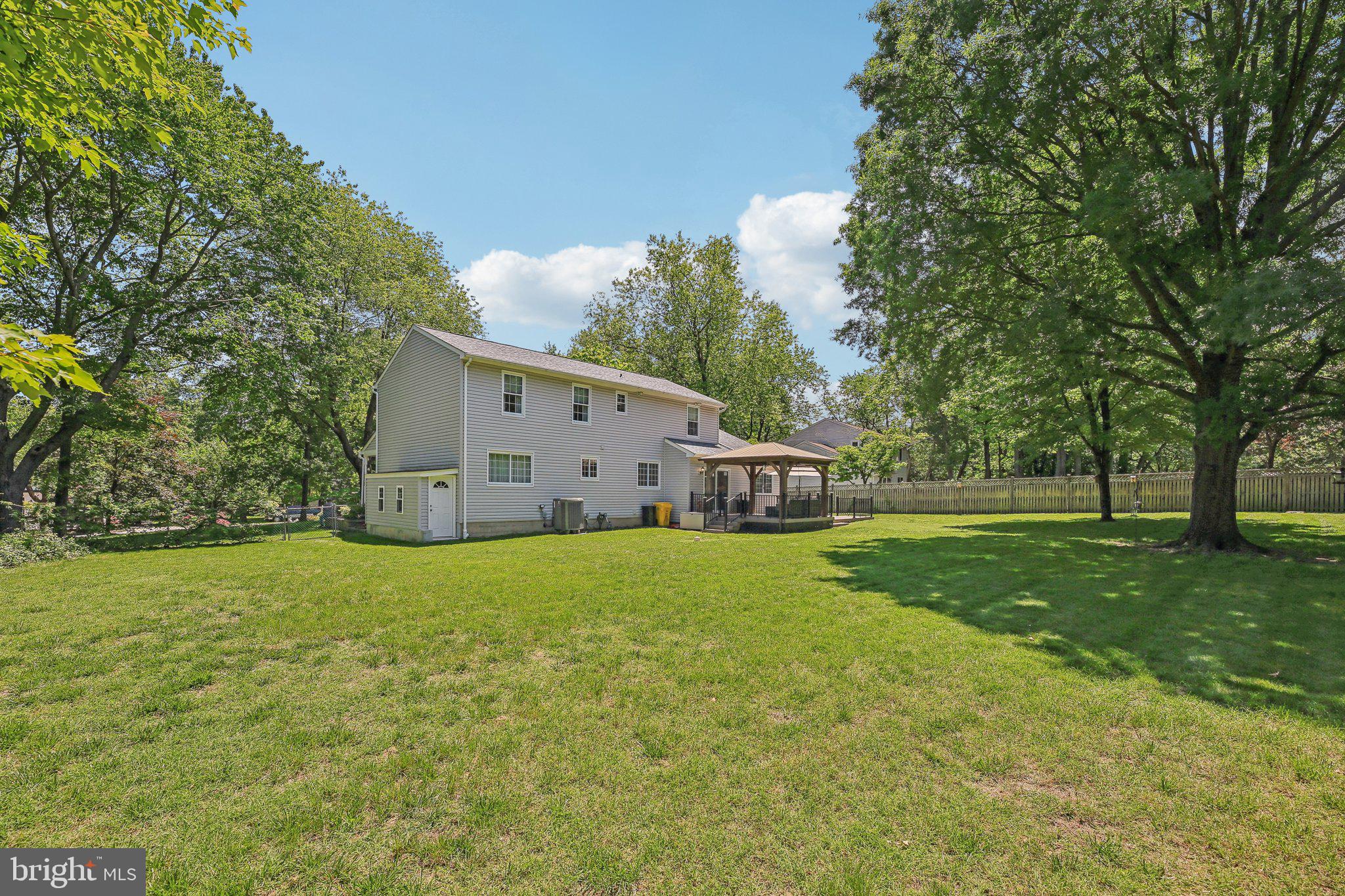 9202 Stone Spring Lane Pasadena, MD 21122 - Photo 37 of 43 a house is sitting in middle od the grass
