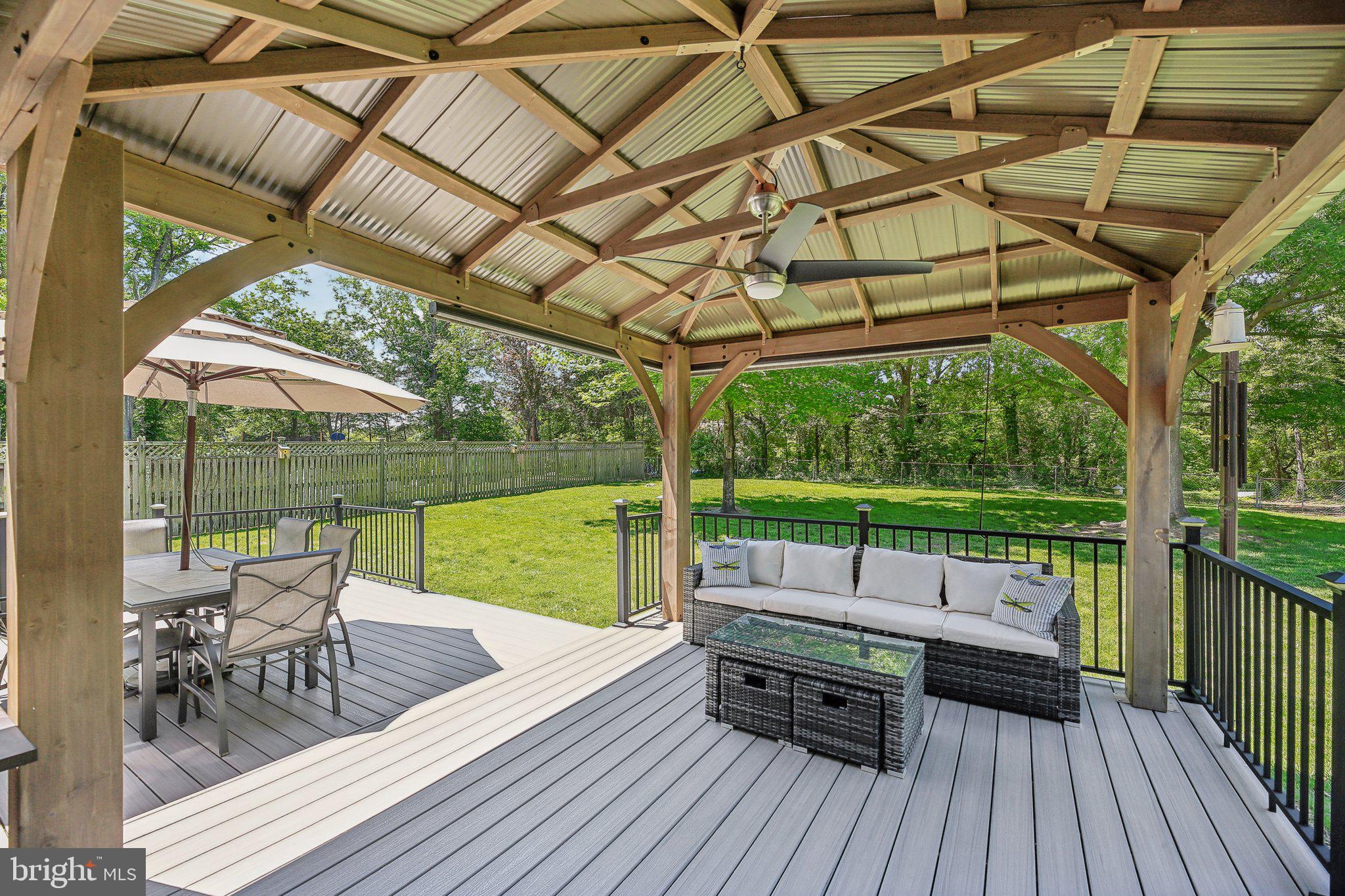 9202 Stone Spring Lane Pasadena, MD 21122 - Photo 38 of 43 a view of deck with patio