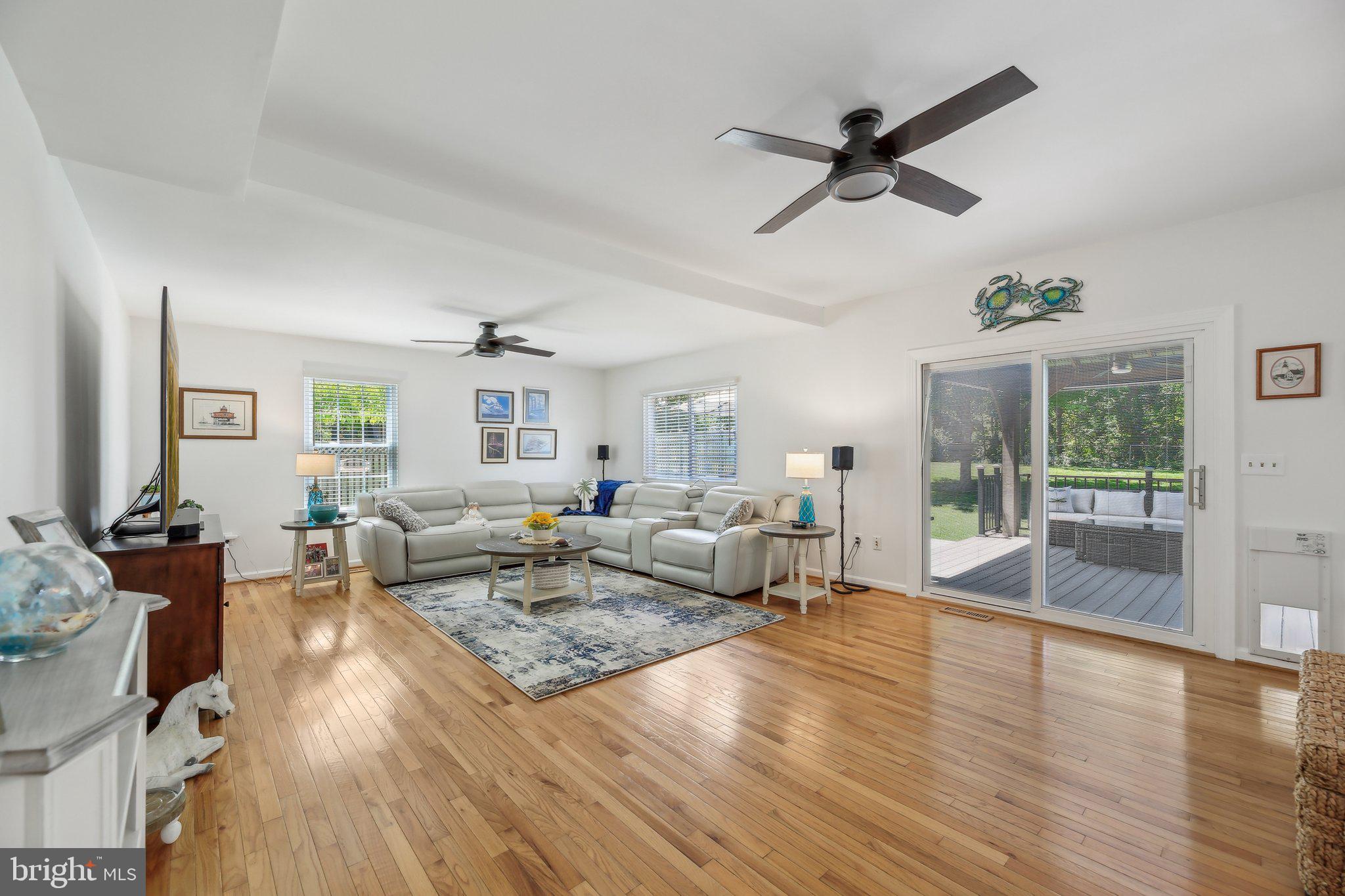 9202 Stone Spring Lane Pasadena, MD 21122 - Photo 7 of 43 a living room with furniture and a wooden floor