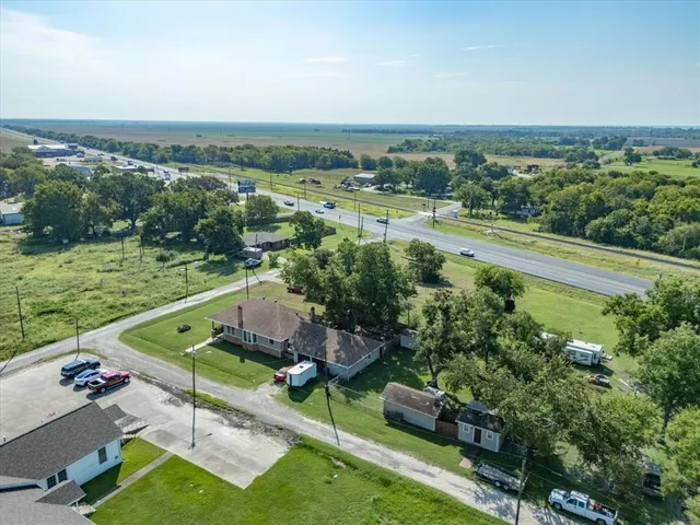 an aerial view of a house with a garden