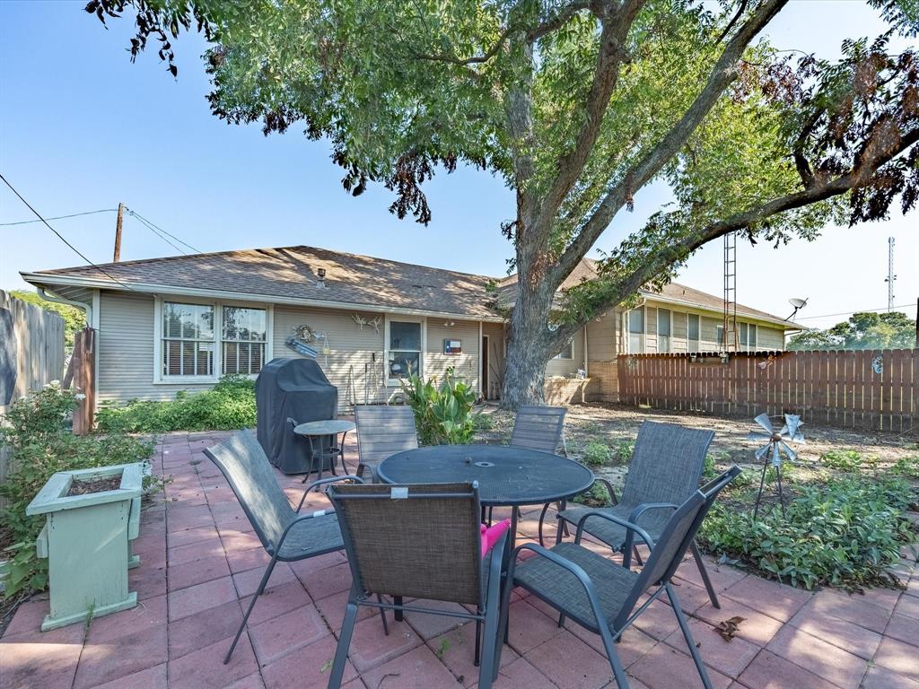 111 Munns Powell, TX 75153 - Photo 24 of 39 a view of a house with backyard sitting area and garden