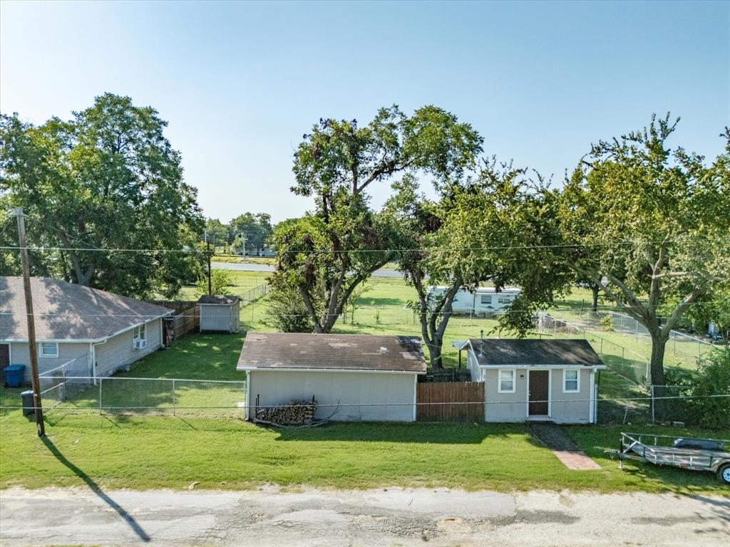 111 Munns Powell, TX 75153 - Photo 28 of 39 a front view of a house with garden
