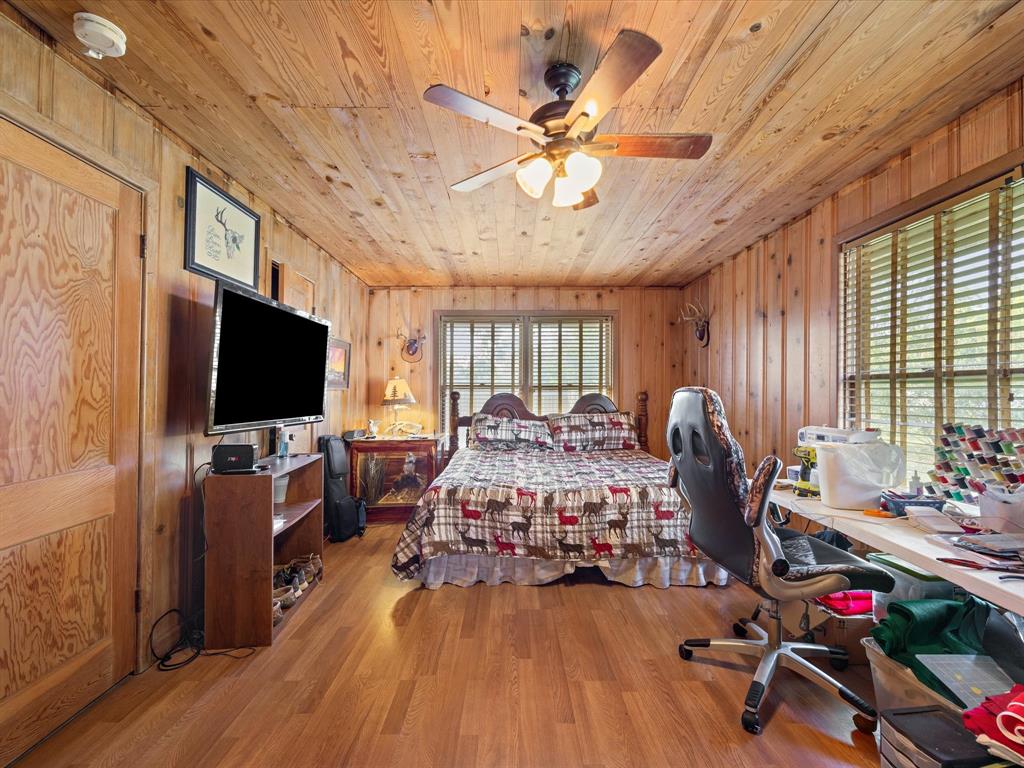 111 Munns Powell, TX 75153 - Photo 31 of 39 a living room with furniture a flat screen tv and a large window