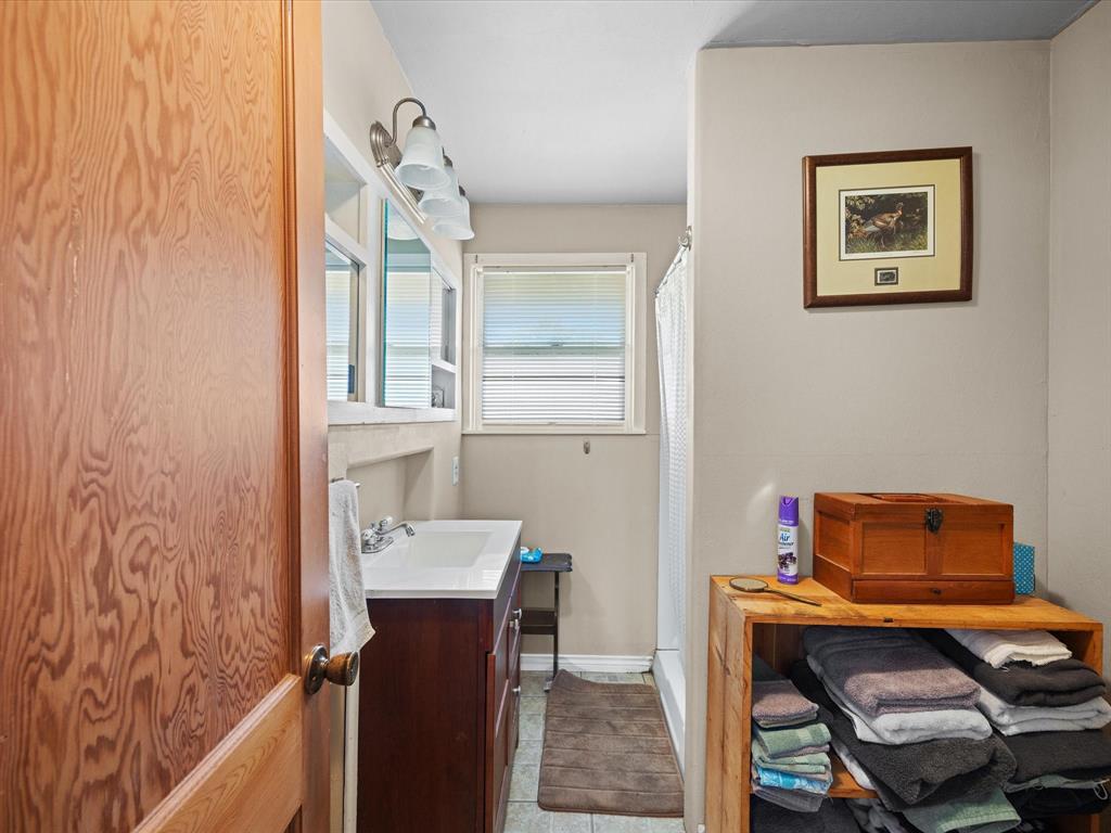 111 Munns Powell, TX 75153 - Photo 33 of 39 a room with furniture and a window