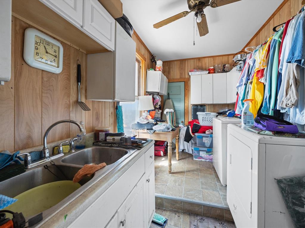 111 Munns Powell, TX 75153 - Photo 34 of 39 a kitchen with lots of clutter and appliances