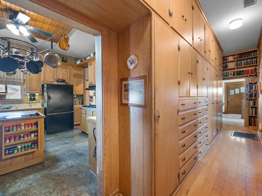 111 Munns Powell, TX 75153 - Photo 7 of 39 a open kitchen with stainless steel appliances kitchen island granite countertop a refrigerator and a stove