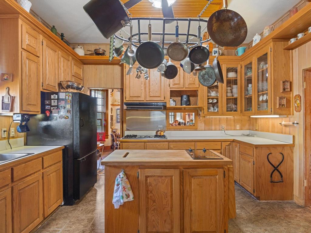 111 Munns Powell, TX 75153 - Photo 8 of 39 a kitchen with stainless steel appliances granite countertop a sink a stove and a refrigerator