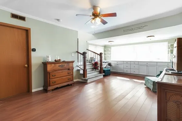 a view of a livingroom with hardwood and furniture