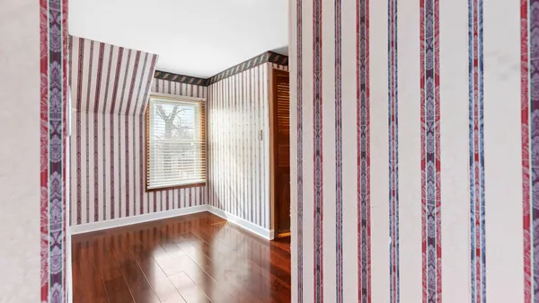 a view of wooden floor and brick walls
