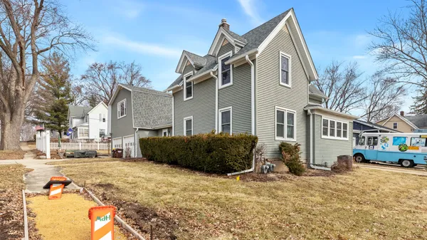 a front view of a building with a yard