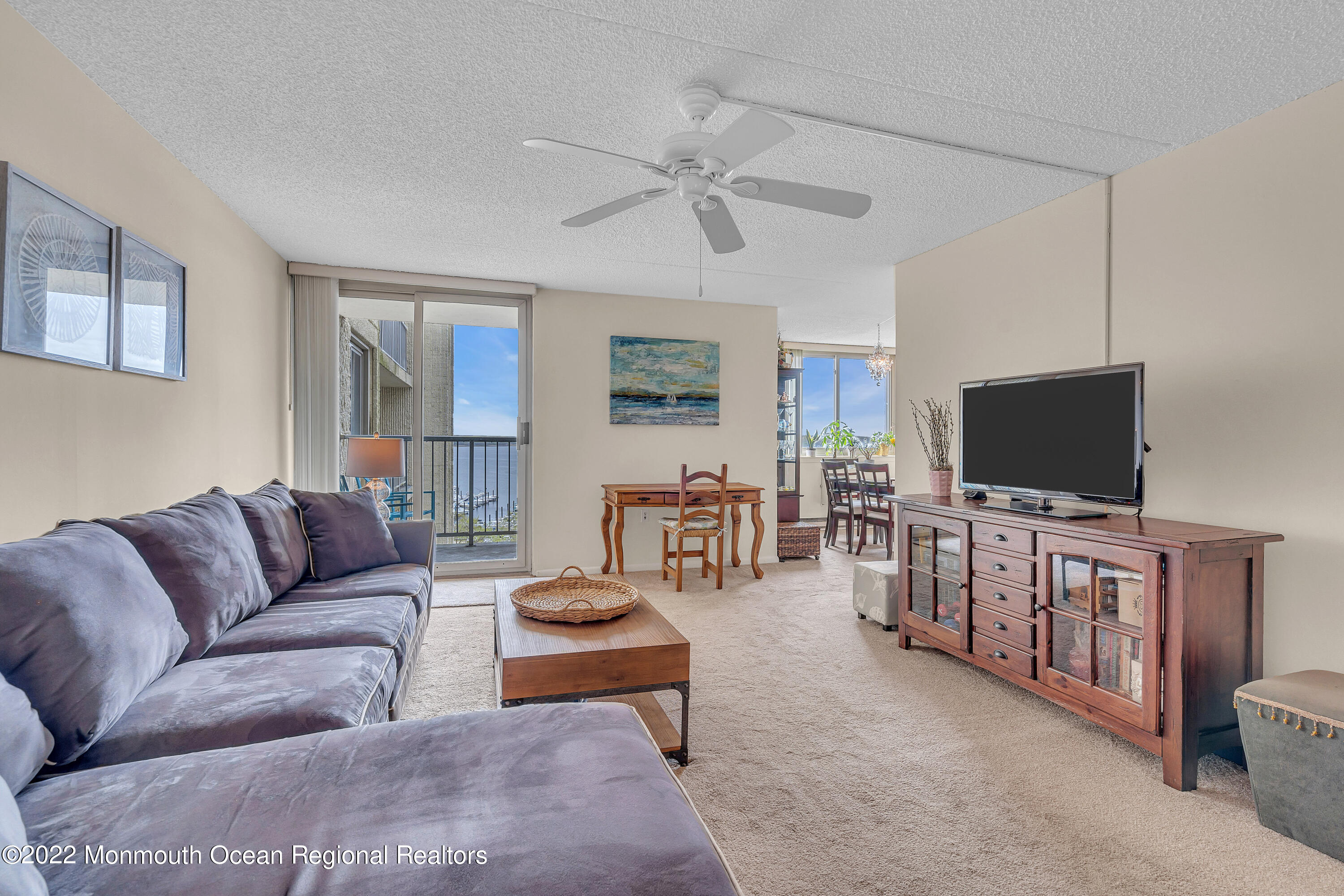 1000 River Road, Unit 7B Belmar, NJ 07719 - Photo 11 of 38 a living room with furniture and a flat screen tv