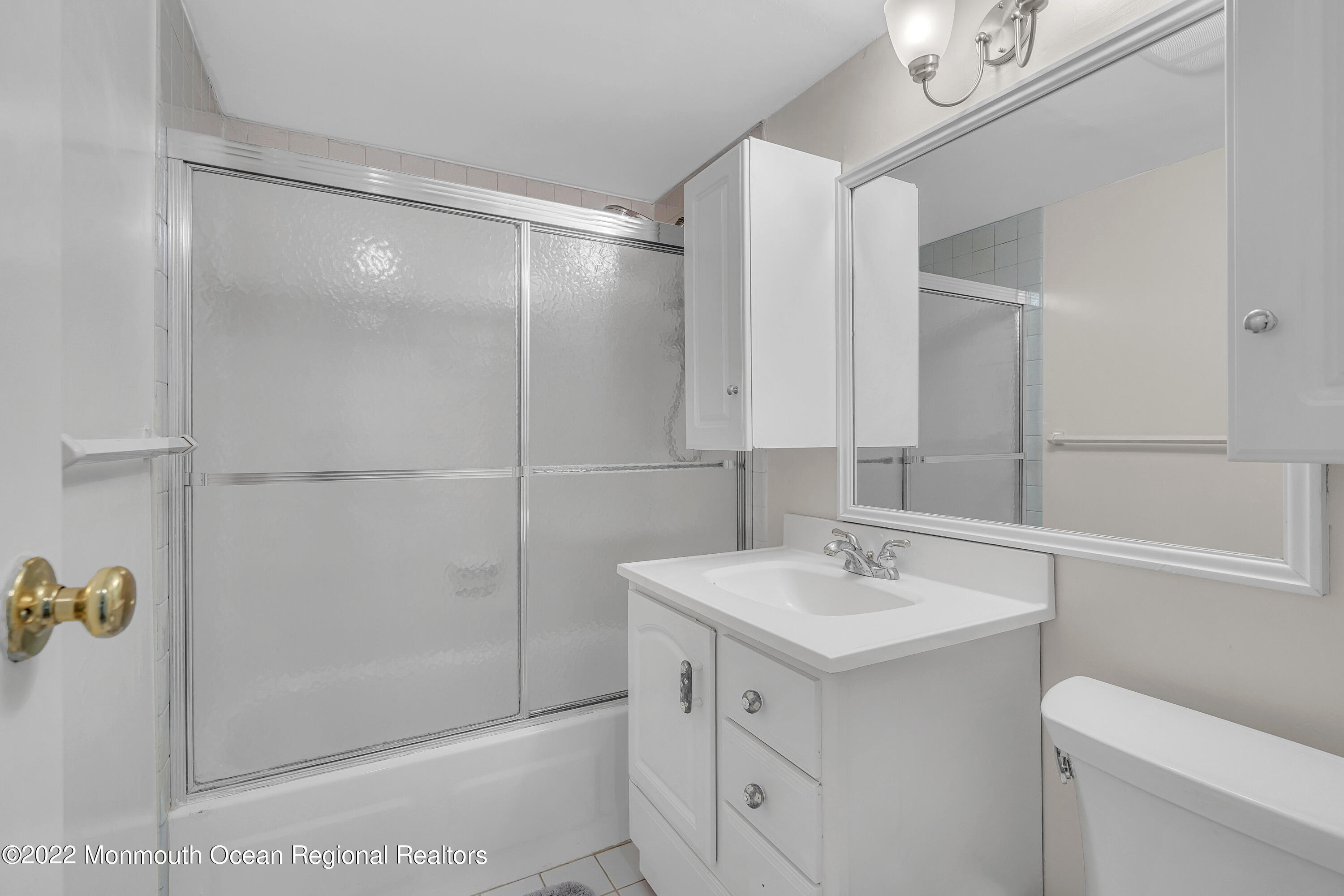 1000 River Road, Unit 7B Belmar, NJ 07719 - Photo 17 of 38 a bathroom with a sink vanity and toilet